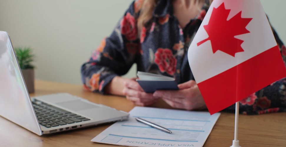 An image showing a women filing her Canadian temporary visa application.